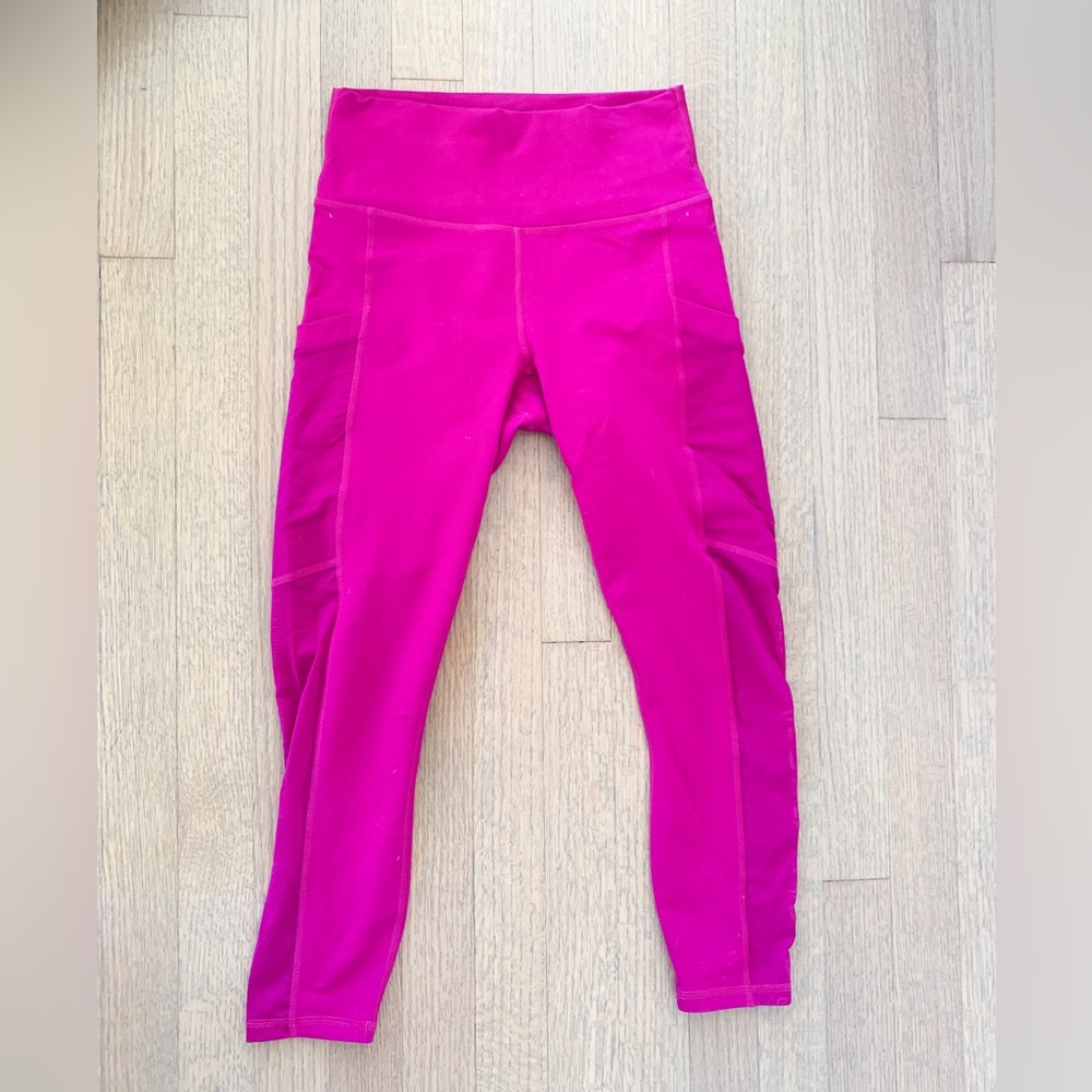 Fabletics On-The-Go PowerHold High-Waisted Capri in vivid purple